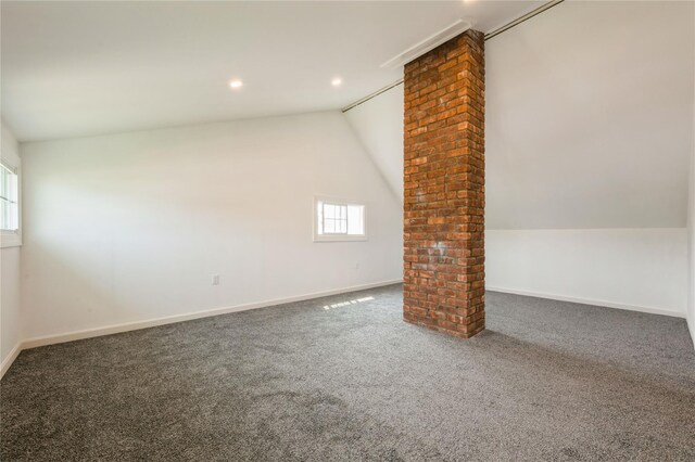 59 Springtime Ln S, Levittown, NY 11756 - additional living space with ornate columns, lofted ceiling, carpet floors, baseboards, and recessed lighting