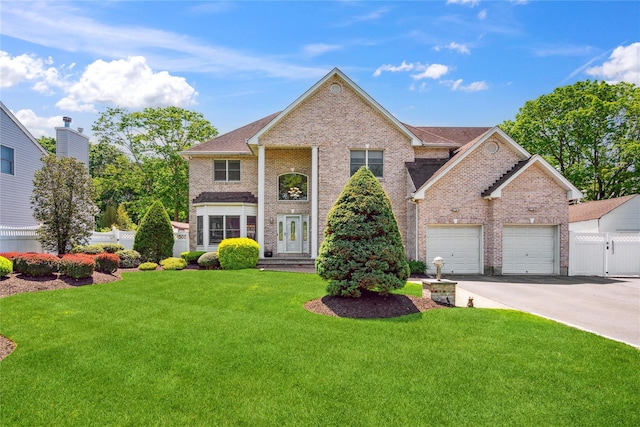 4 Millennium Ct, Bohemia, NY 11716 - neoclassical / greek revival house featuring driveway, brick siding, and a garage