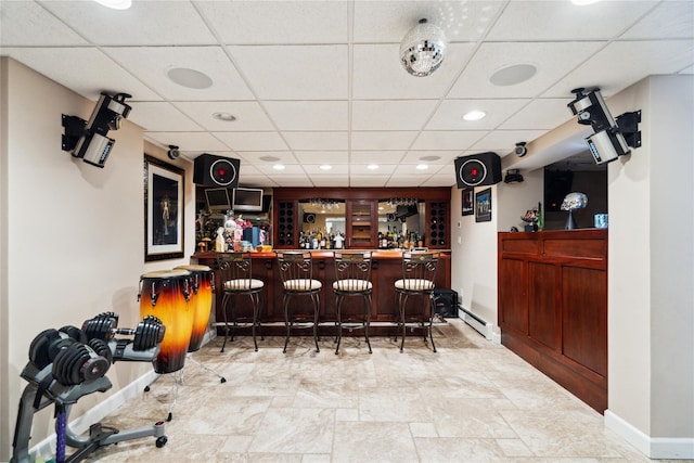 4 Millennium Ct, Bohemia, NY 11716 - indoor dry bar with baseboards, a drop ceiling, recessed lighting, stone finish flooring, and baseboard heating