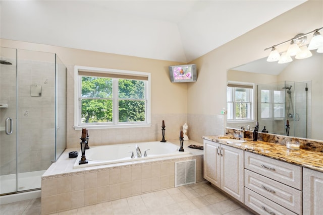 4 Millennium Ct, Bohemia, NY 11716 - full bath with plenty of natural light, vanity, a bath, a shower stall, and vaulted ceiling