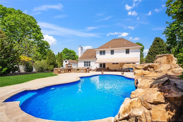 4 Millennium Ct, Bohemia, NY 11716 - outdoor pool featuring an outdoor kitchen and a patio area