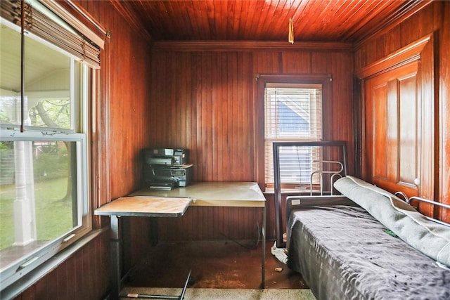 bedroom featuring wood ceiling and wooden walls