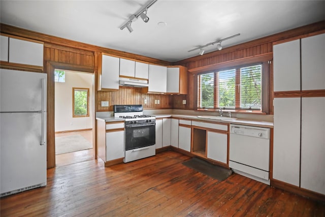 kitchen with white appliances, track lighting, under cabinet range hood, white cabinetry, and light countertops