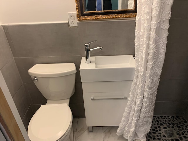 333 Lehrer Ave, Elmont, NY 11003 - full bath featuring a stall shower, toilet, tile walls, vanity, and marble look tile flooring