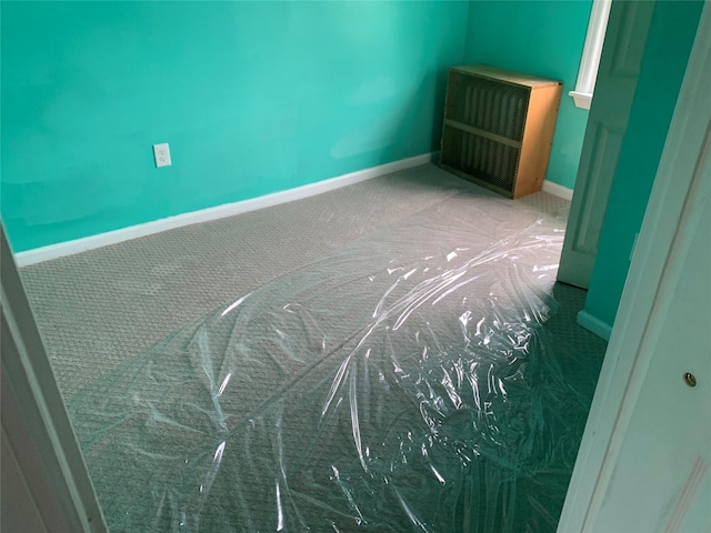 333 Lehrer Ave, Elmont, NY 11003 - carpeted empty room featuring radiator heating unit and baseboards