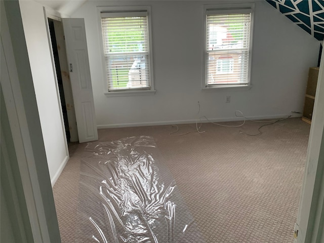 333 Lehrer Ave, Elmont, NY 11003 - empty room with light colored carpet, plenty of natural light, and baseboards