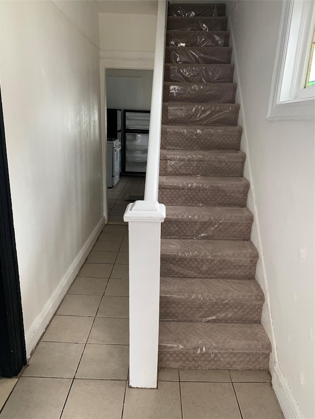 333 Lehrer Ave, Elmont, NY 11003 - staircase featuring tile patterned flooring and baseboards