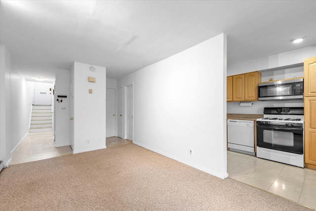 2-20 Capstan Ct Unit 102B, College Point, NY 11356 - unfurnished living room with light tile patterned flooring, stairway, light colored carpet, and baseboards