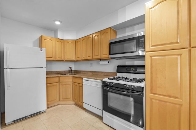 2-20 Capstan Ct Unit 102B, College Point, NY 11356 - kitchen with white appliances, a sink, and light brown cabinetry