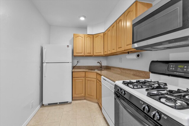 2-20 Capstan Ct Unit 102B, College Point, NY 11356 - kitchen featuring white appliances, a sink, and light countertops