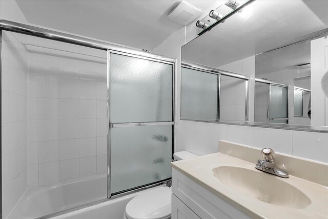 2-20 Capstan Ct Unit 102B, College Point, NY 11356 - bathroom featuring toilet, shower / bath combination with glass door, and vanity