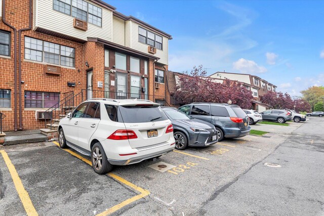 2-20 Capstan Ct Unit 102B, College Point, NY 11356 - view of building exterior with uncovered parking