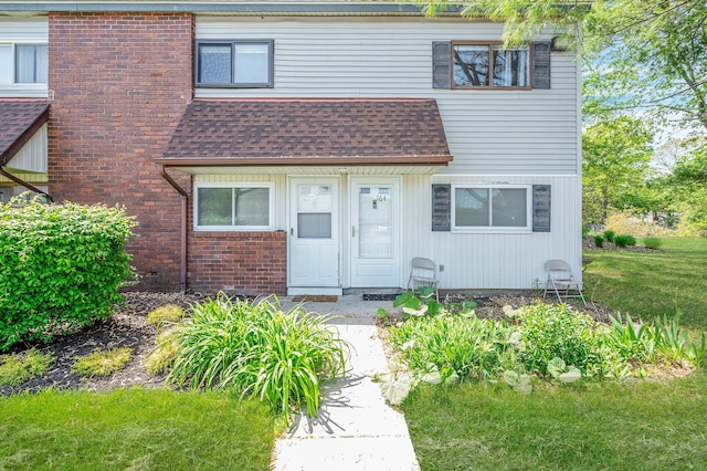 163 Pointe Cir N Unit 163, Coram, NY 11727 - view of front of house featuring roof with shingles and brick siding