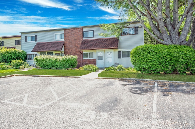 163 Pointe Cir N Unit 163, Coram, NY 11727 - multi unit property with uncovered parking, a shingled roof, and brick siding