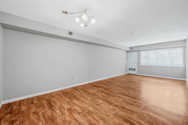 163 Pointe Cir N Unit 163, Coram, NY 11727 - unfurnished living room featuring baseboards and wood finished floors