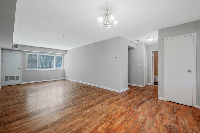 163 Pointe Cir N Unit 163, Coram, NY 11727 - unfurnished living room with wood finished floors, a chandelier, and baseboards