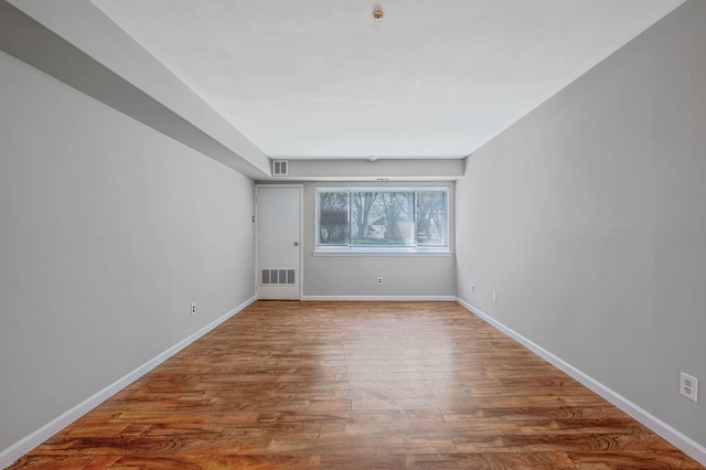 163 Pointe Cir N Unit 163, Coram, NY 11727 - empty room featuring wood finished floors and baseboards