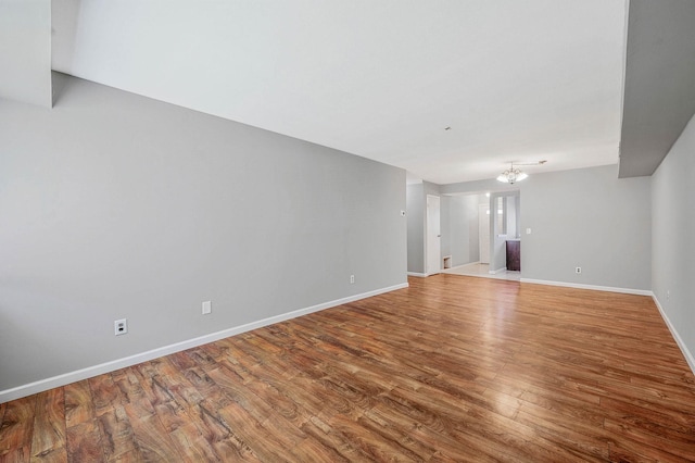 163 Pointe Cir N Unit 163, Coram, NY 11727 - unfurnished living room featuring wood finished floors and baseboards