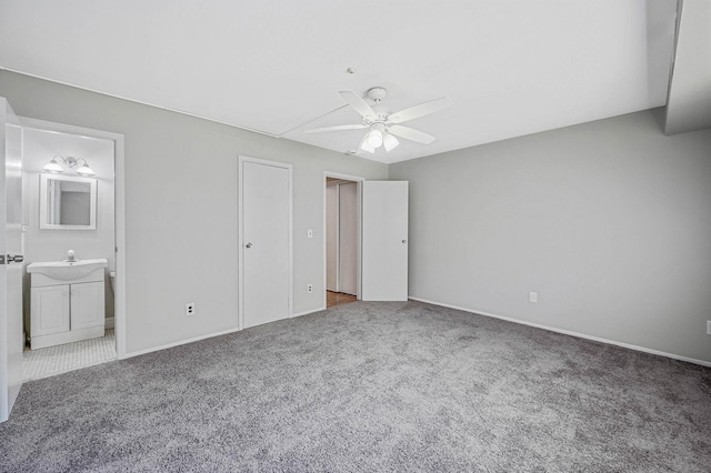163 Pointe Cir N Unit 163, Coram, NY 11727 - unfurnished bedroom with carpet floors, a sink, baseboards, and ensuite bath