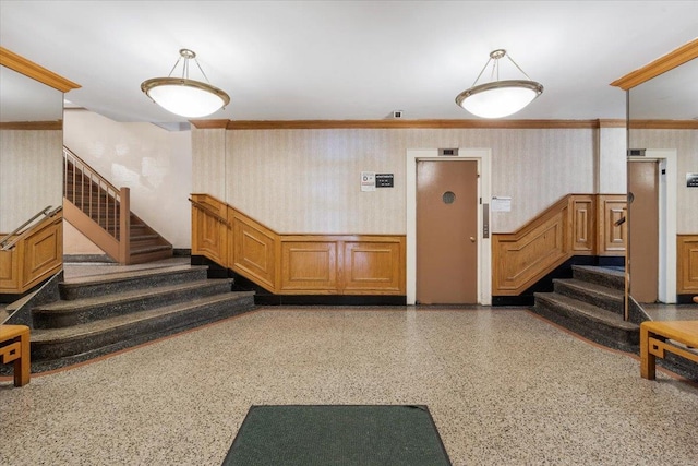 13909 84th Dr Unit 308, Briarwood, NY 11435 - lobby featuring stairway, crown molding, and wallpapered walls