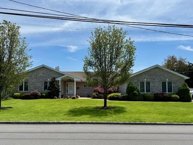 26 Haide Pl, East Islip, NY 11730 - single story home with stone siding and a front lawn
