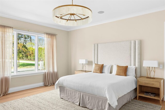 171 Oneck Ln, Westhampton Beach, NY 11978 - bedroom featuring ornamental molding, light wood-style flooring, baseboards, and visible vents