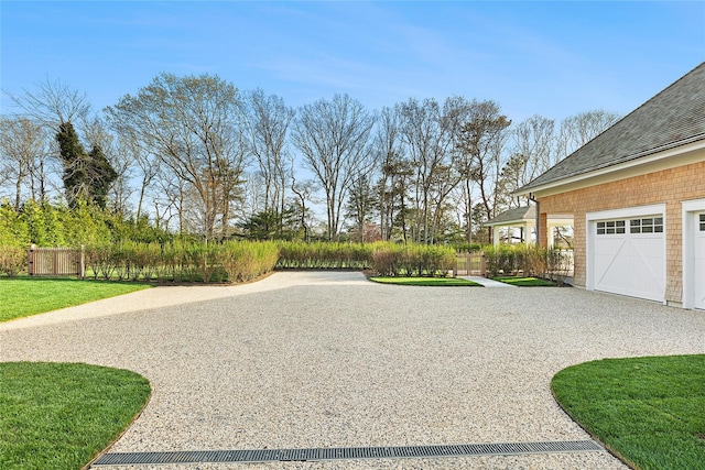 171 Oneck Ln, Westhampton Beach, NY 11978 - view of yard featuring driveway and fence