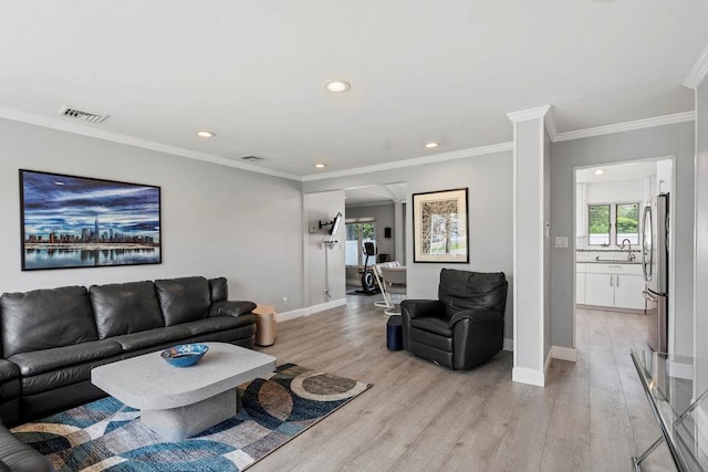 214 Central Park Rd, Plainview, NY 11803 - living room with light wood-style floors, recessed lighting, baseboards, and crown molding