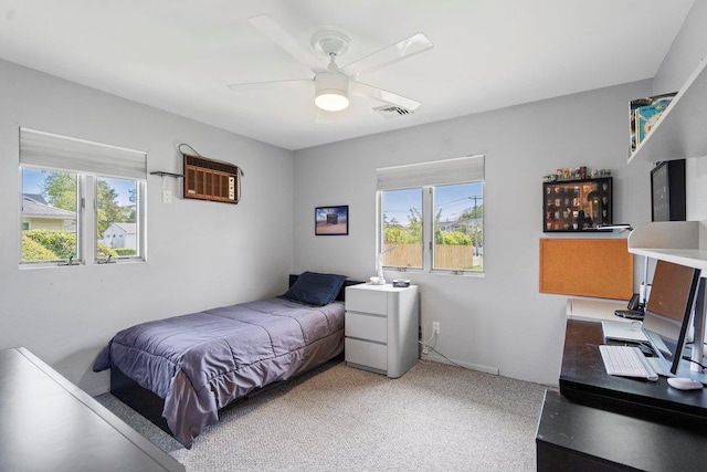 214 Central Park Rd, Plainview, NY 11803 - bedroom with multiple windows, a ceiling fan, and a wall mounted air conditioner