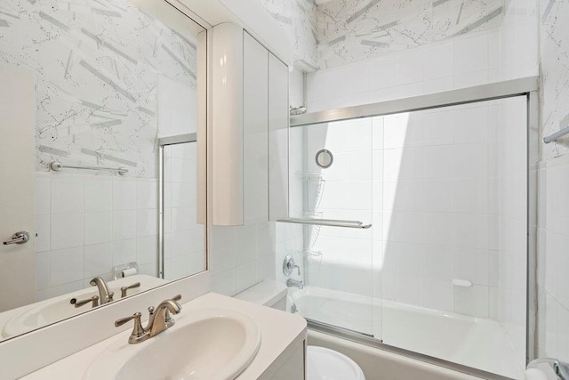 214 Central Park Rd, Plainview, NY 11803 - bathroom with tile walls, toilet, bath / shower combo with glass door, and vanity