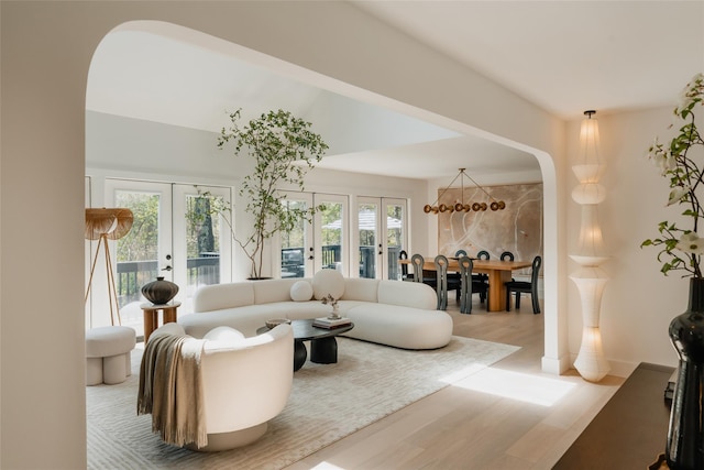 825 County Route 6, High Falls, NY 12440 - living room featuring french doors, wood finished floors, and healthy amount of natural light