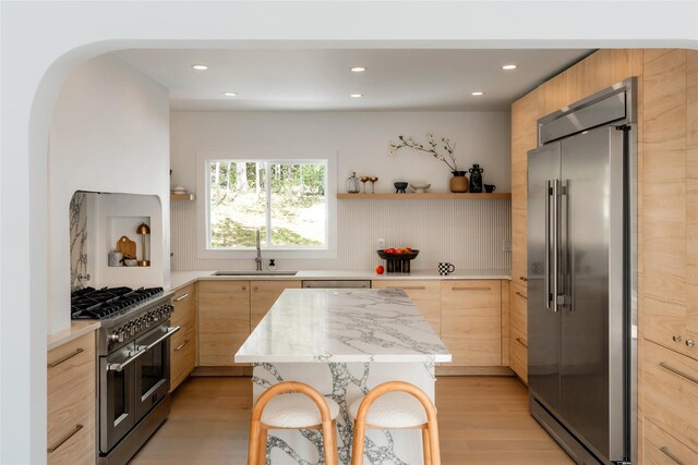 825 County Route 6, High Falls, NY 12440 - kitchen with high end appliances, a sink, light brown cabinets, modern cabinets, and recessed lighting
