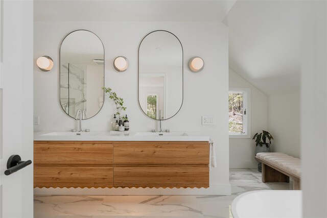 825 County Route 6, High Falls, NY 12440 - bathroom featuring marble finish floors, double vanity, and vaulted ceiling