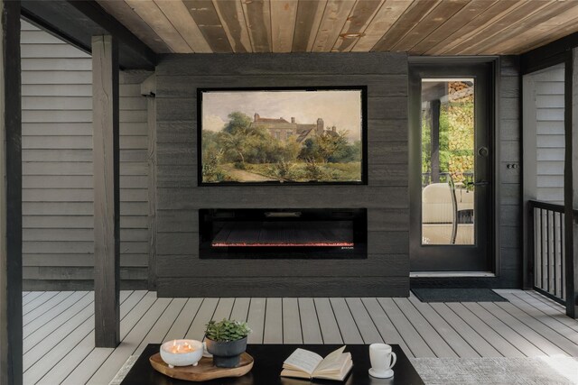 825 County Route 6, High Falls, NY 12440 - doorway to property featuring a glass covered fireplace and a deck