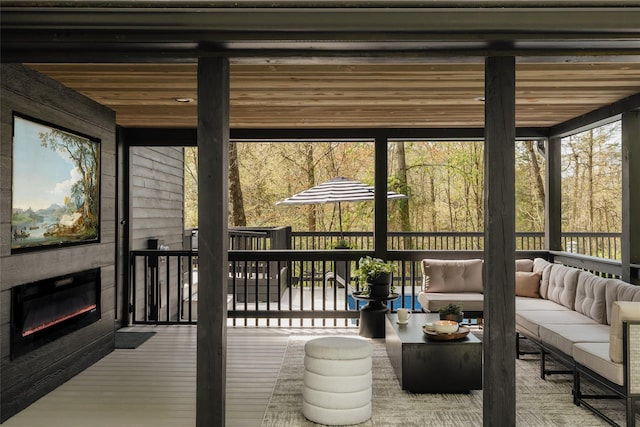 825 County Route 6, High Falls, NY 12440 - sunroom featuring an outdoor living space with a fireplace and plenty of natural light