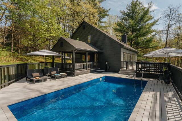 825 County Route 6, High Falls, NY 12440 - view of pool with a wooden deck, a patio, and an outdoor living space