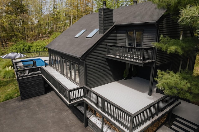 825 County Route 6, High Falls, NY 12440 - back of house featuring a wooden deck and a chimney