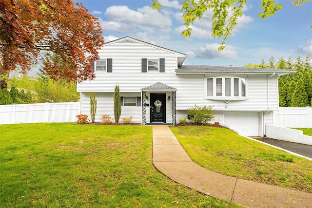 22 Chauncey St, Tuckahoe, NY 10707 - tri-level home with a garage, driveway, and a shingled roof