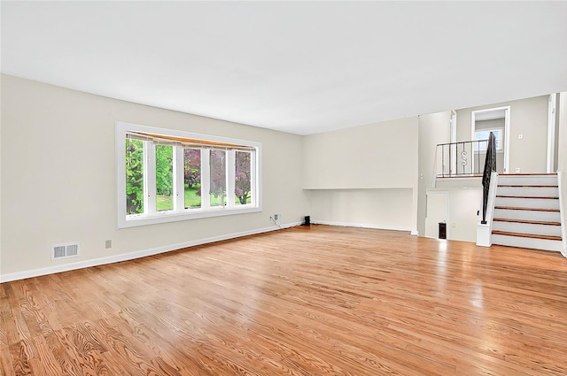 22 Chauncey St, Tuckahoe, NY 10707 - unfurnished living room featuring light wood finished floors, stairs, and baseboards