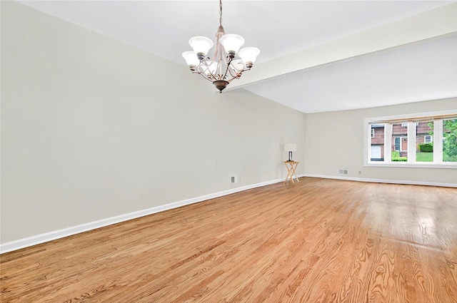 22 Chauncey St, Tuckahoe, NY 10707 - unfurnished room featuring light wood finished floors, a chandelier, and baseboards