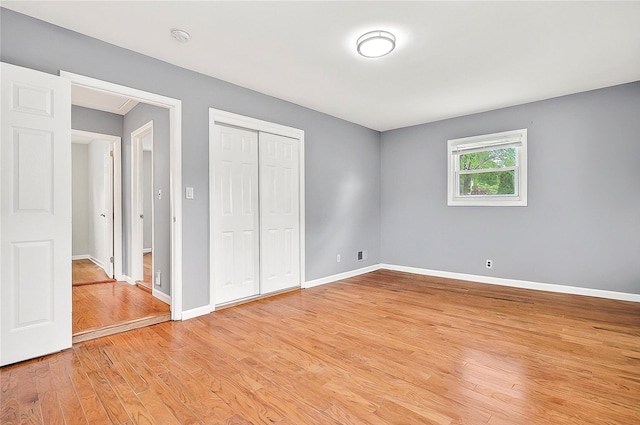 22 Chauncey St, Tuckahoe, NY 10707 - unfurnished bedroom featuring light wood-style flooring, baseboards, and a closet