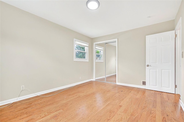 22 Chauncey St, Tuckahoe, NY 10707 - unfurnished bedroom featuring baseboards, light wood-type flooring, and a closet