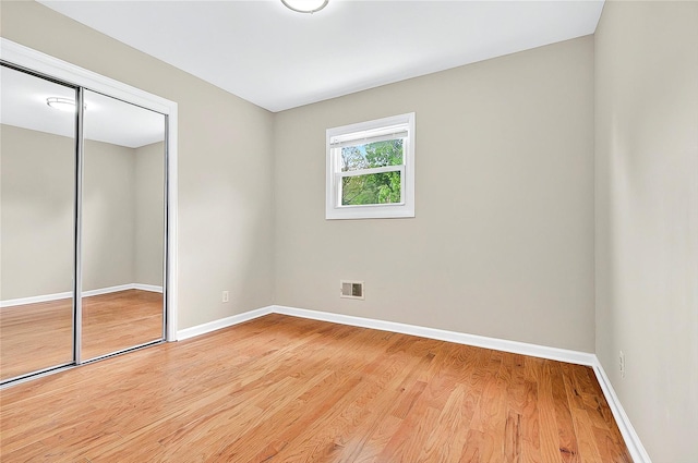 22 Chauncey St, Tuckahoe, NY 10707 - unfurnished bedroom featuring baseboards, light wood-type flooring, and a closet
