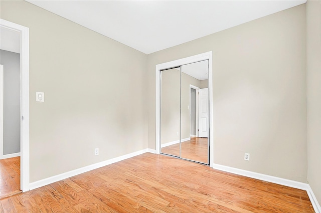 22 Chauncey St, Tuckahoe, NY 10707 - unfurnished bedroom featuring light wood finished floors, baseboards, and a closet