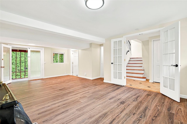 22 Chauncey St, Tuckahoe, NY 10707 - unfurnished room featuring french doors, wood finished floors, baseboards, and stairs