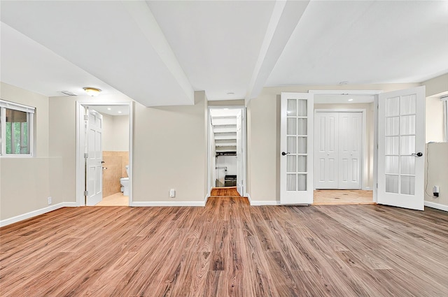 22 Chauncey St, Tuckahoe, NY 10707 - unfurnished bedroom with baseboards, french doors, wood finished floors, and a closet