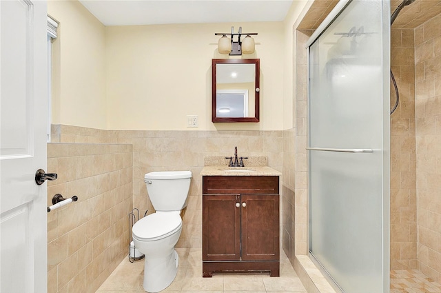 22 Chauncey St, Tuckahoe, NY 10707 - full bath with tile walls, a shower stall, toilet, wainscoting, and tile patterned flooring