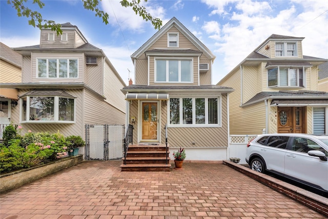 78-28 64th Pl, Glendale, NY 11385 - american foursquare style home featuring a gate and fence
