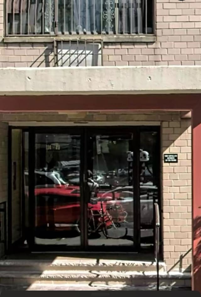 134-46 Maple Ave Unit 6B, Flushing, NY 11355 - view of exterior entry with a balcony