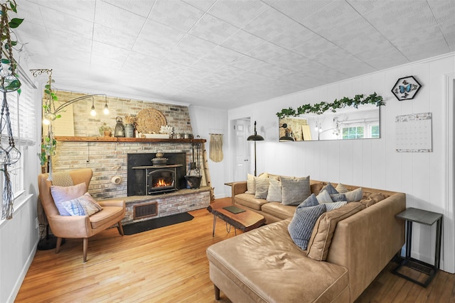 46 Quaker Hill Rd, Monroe, NY 10950 - living room featuring a brick fireplace and hardwood / wood-style flooring